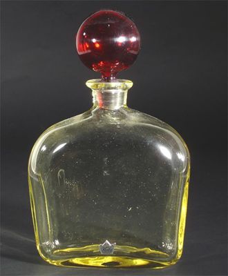 Appraisal: A Kosta glass decanter and stopper amber glass with ruby