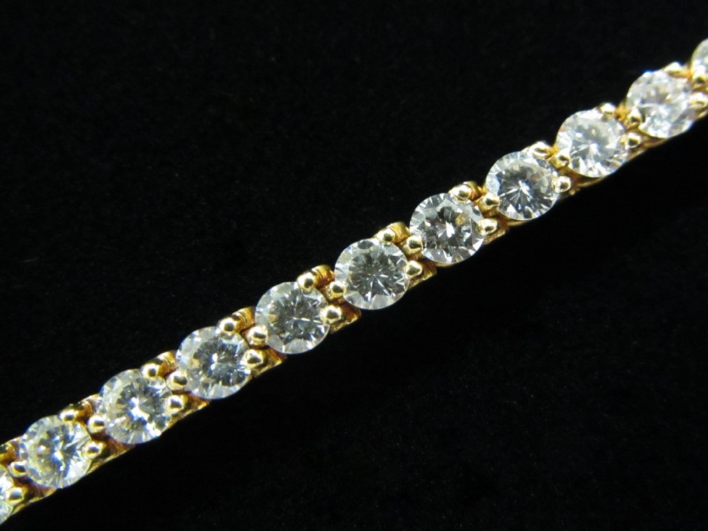 Appraisal: A fine Cartier diamond line bracelet with forty nine brilliant