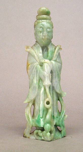 Appraisal: A small mottled white and pale green jadeite figure of