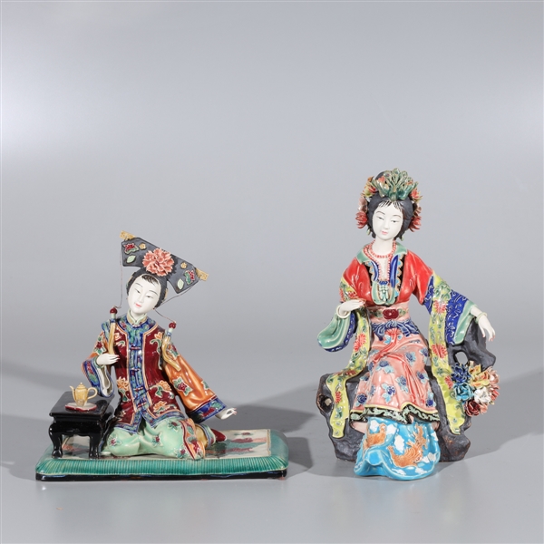 Appraisal: Pair of Chinese porcelain figures of two seated beauties with