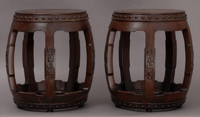 Appraisal: PAIR OF CHINESE CARVED HONGMU BARREL-FORM STOOLS Each top with