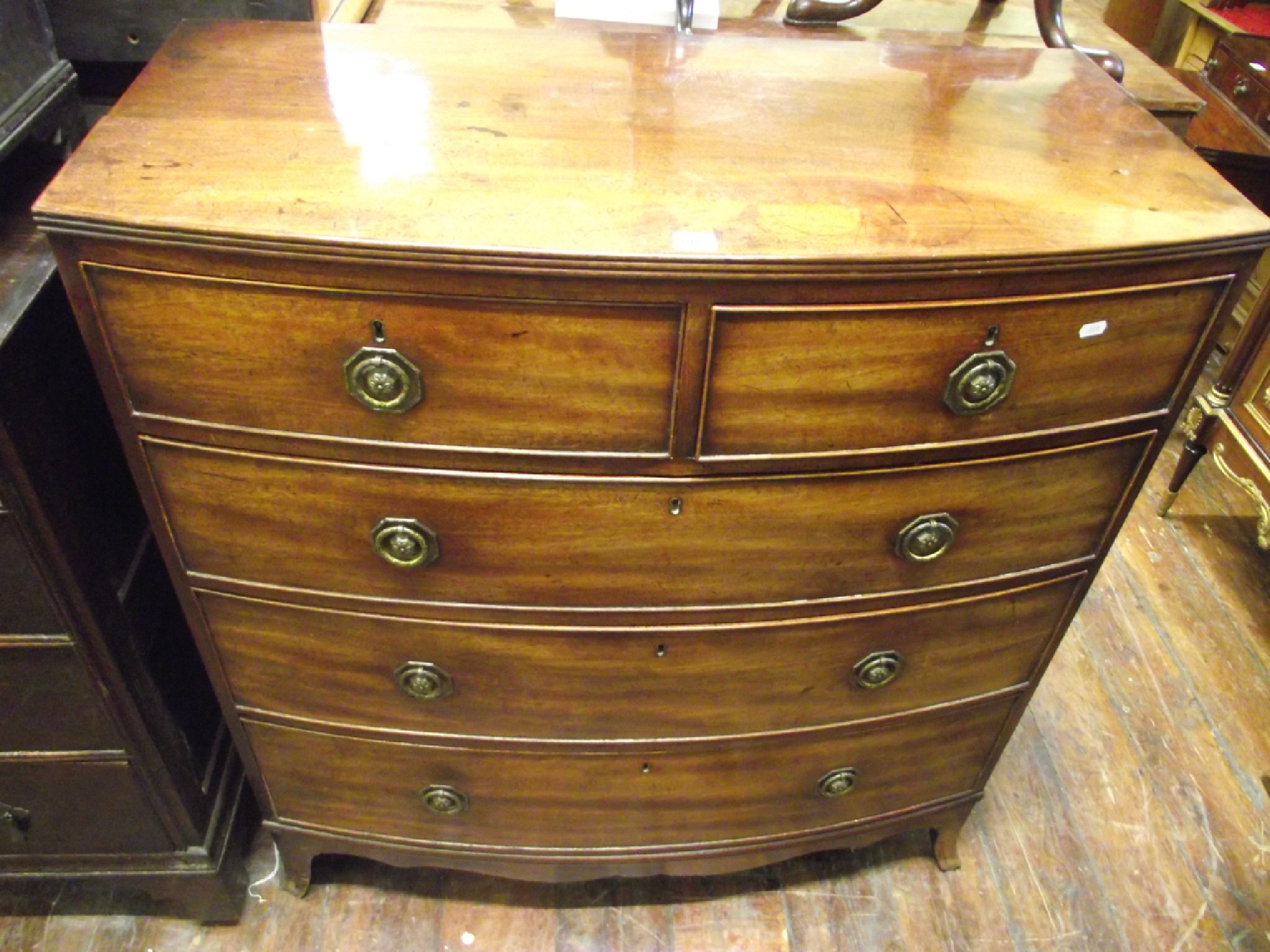 Appraisal: A Regency mahogany bow fronted chest of three long and