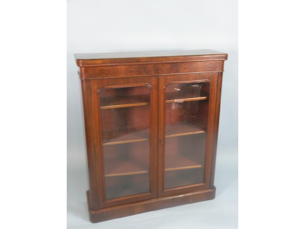 Appraisal: A Victorian walnut bookcase with a moulded cornice above two