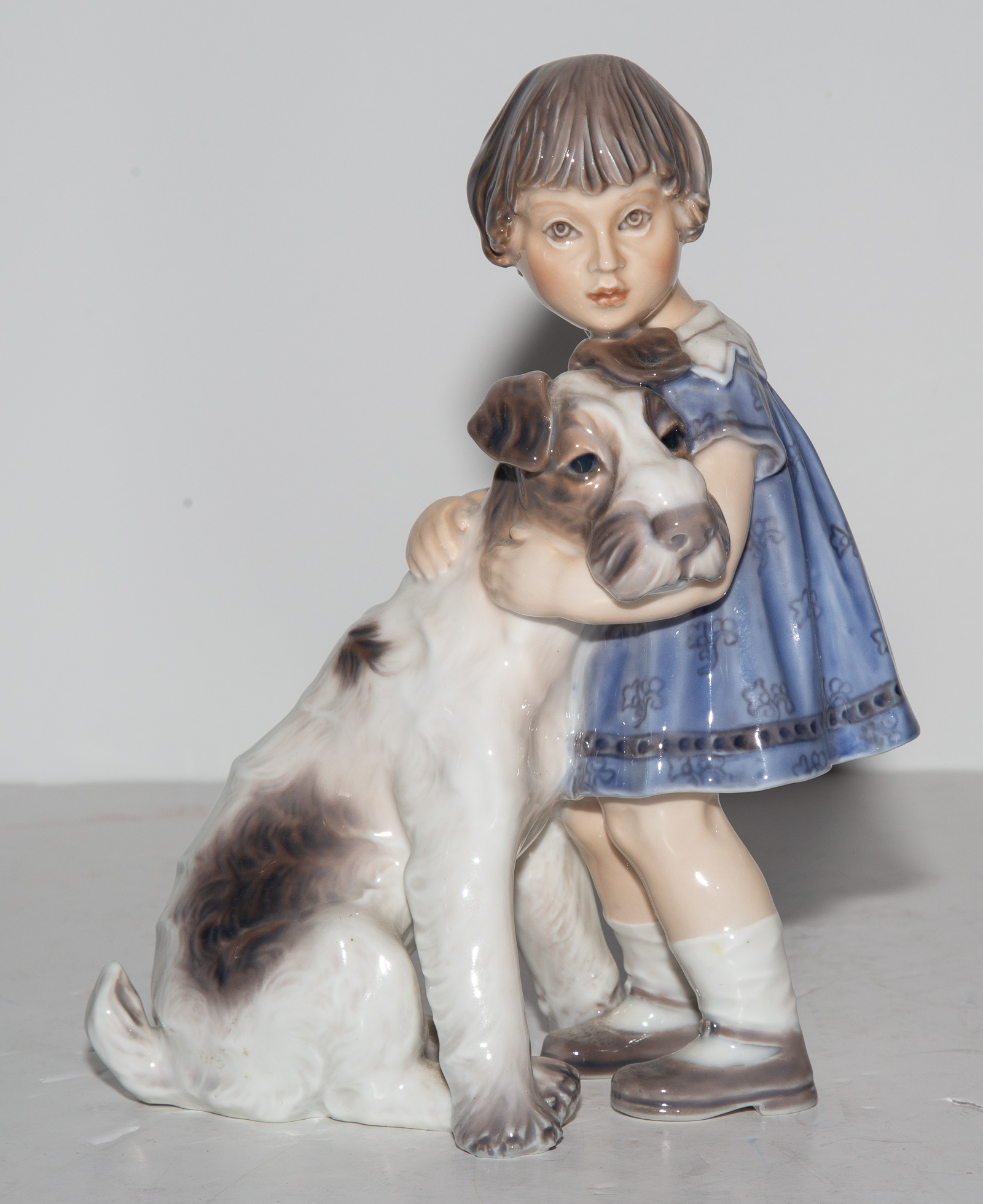 Appraisal: DAHL JENSEN COPENHAGEN PORCELAIN FIGURE Young Girl Hugging her Dog