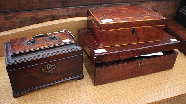 Appraisal: A GEORGE III MAHOGANY TEA CADDY with three divisions and