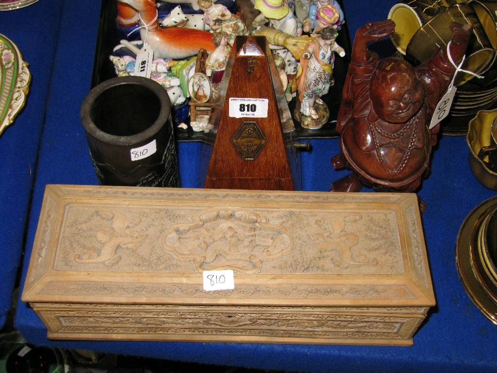 Appraisal: Carved wooden box buddha figure bamboo brush pot and metronome