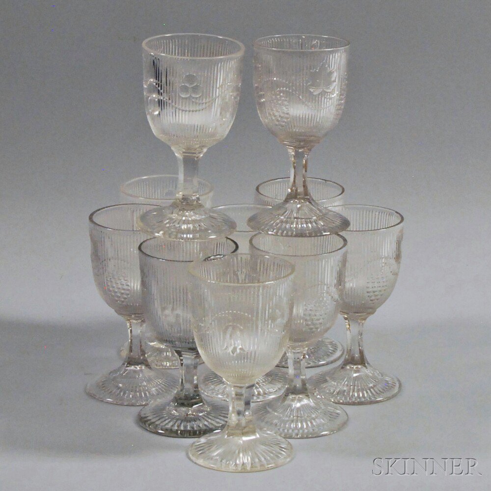 Appraisal: Ten Ribbed Colorless Pattern Glass Goblets th century depicting vines