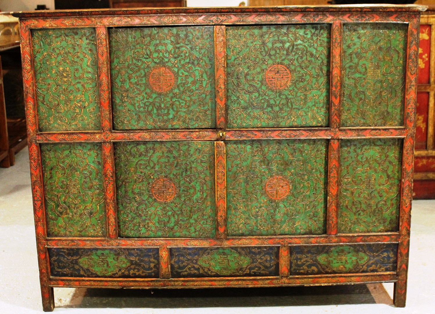 Appraisal: A th century Eastern green and red lacquered side cabinet