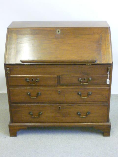 Appraisal: A GEORGE II MAHOGANY BUREAU the fall front with book