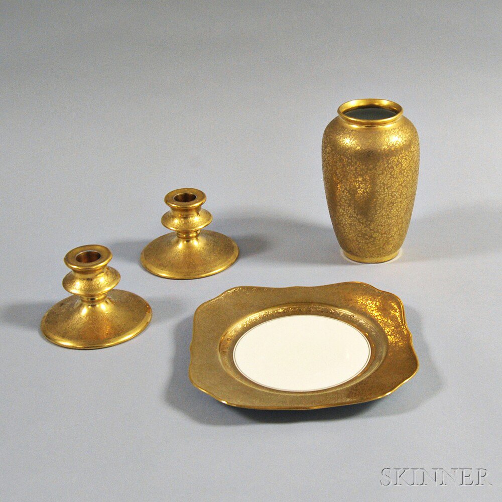 Appraisal: Four Pieces of Gilt Porcelain a pair of Pickard candlestick