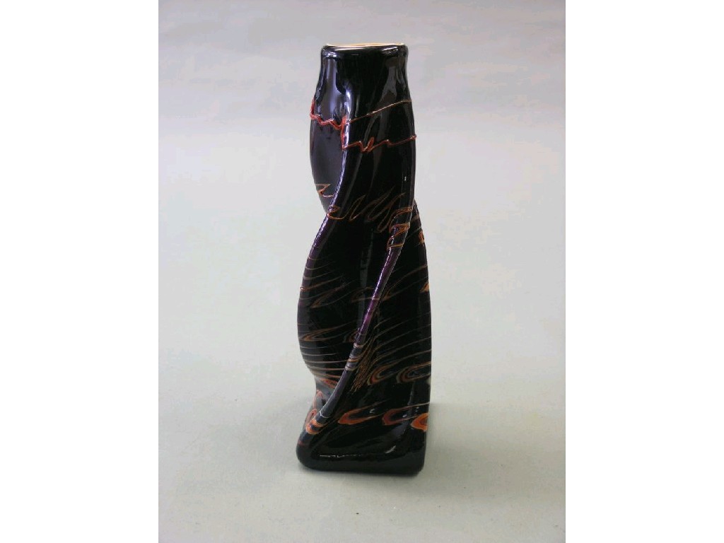 Appraisal: An art glass vase amethyst coloured glass of wrythen form