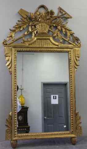 Appraisal: Italian Gilt Mirror with Basket of Flower Motif From a