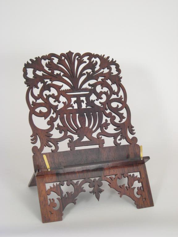 Appraisal: A Victorian rosewood folding Book Stand with floral scroll design