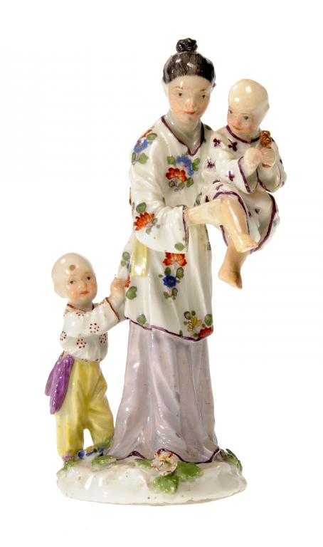 Appraisal: A MEISSEN CHINOISERIE GROUP OF A YOUNG WOMAN AND TWO