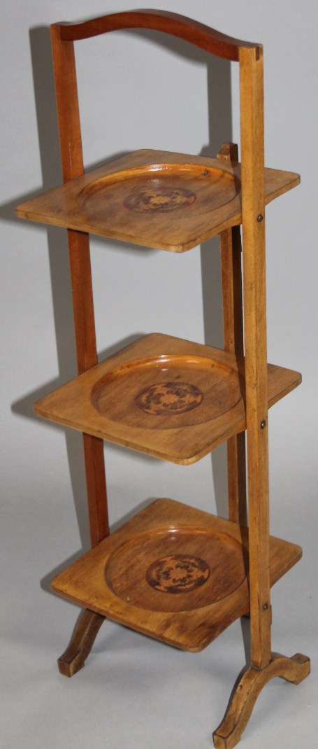 Appraisal: An early thC beech and marquetry inlaid three tier cake