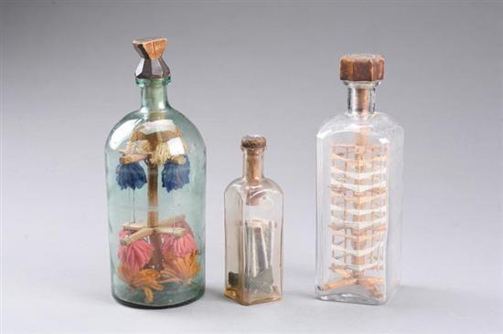 Appraisal: THREE BOTTLE WHIMSEYS American early th century wood and yarn