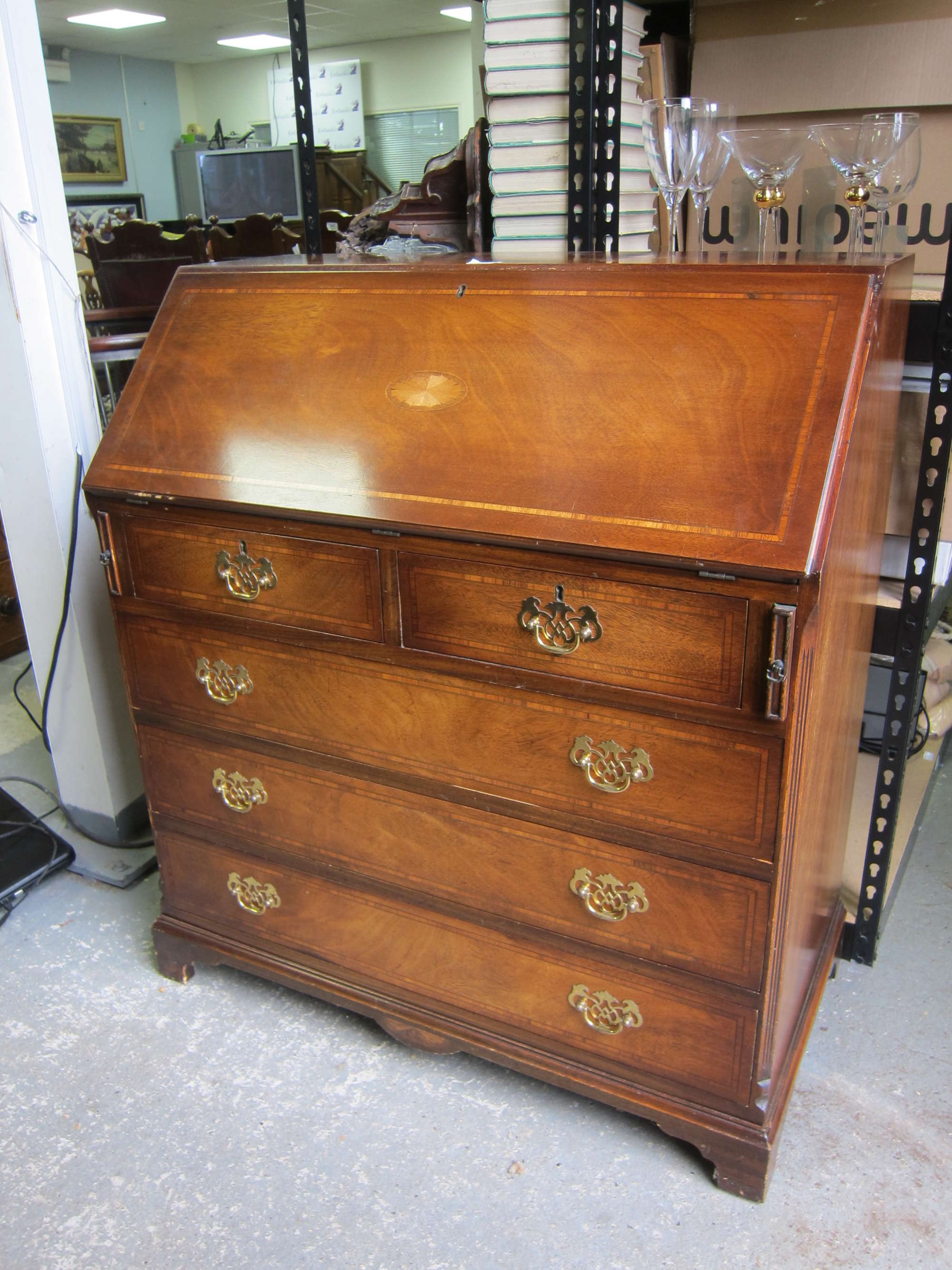 Appraisal: th century mahogany fall front bureau with two small over