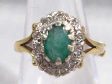 Appraisal: A carat gold emerald and diamond cluster ring