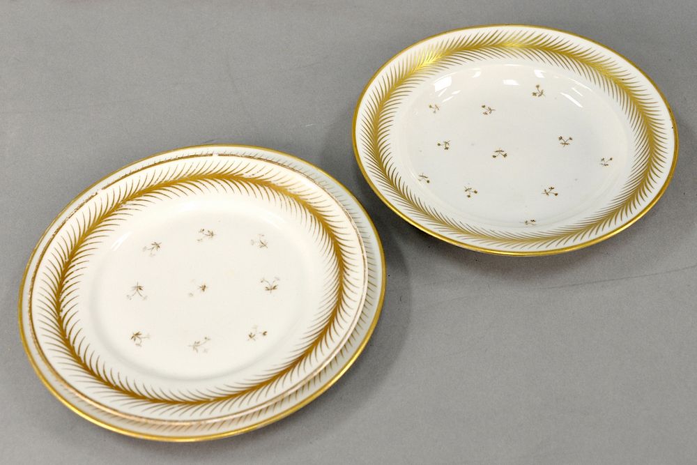 Appraisal: Large set of porcelain dinnerware having gilt feather rims and