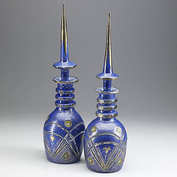 Appraisal: PAIR OF BOHEMIAN GLASS BOTTLESBlue and gold with floral highlights