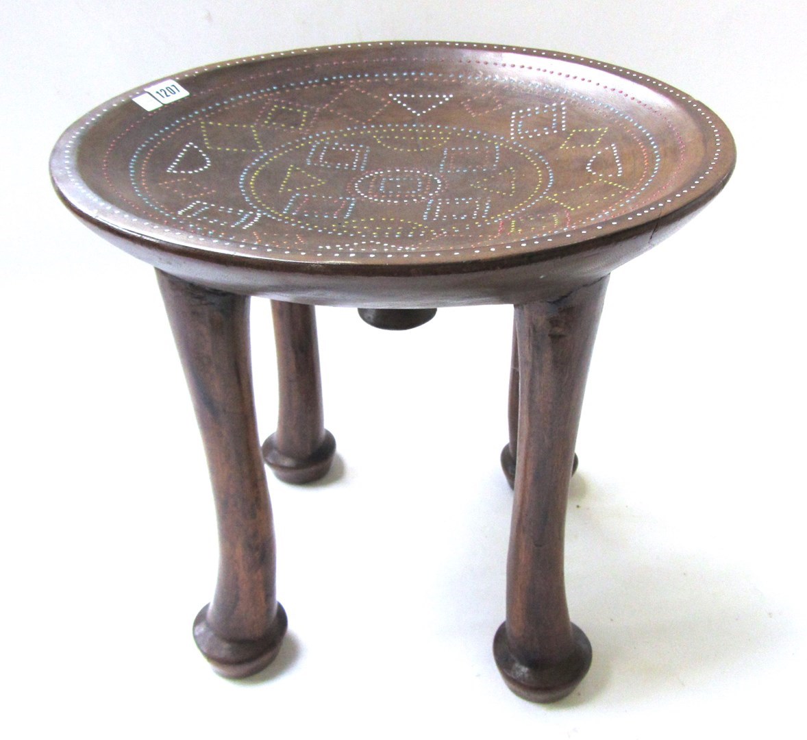 Appraisal: A th century African hardwood stool with dished top on