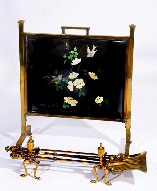 Appraisal: AN ART NOUVEAU BRASS FIRE SCREEN with carrying handle inset