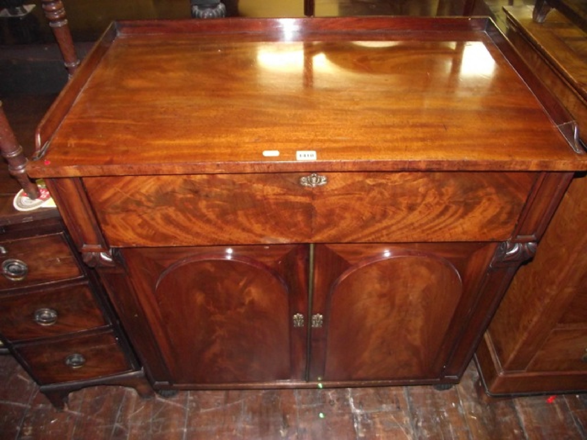 Appraisal: A late Regency mahogany secretaire the lower section enclosed by