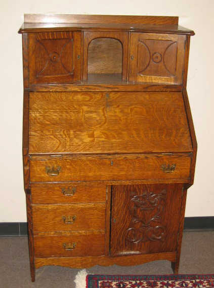 Appraisal: AMERICAN OAK ARTS AND CRAFTS DESK The angled top with