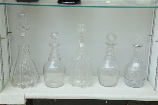 Appraisal: FIVE BLOWN GLASS DECANTERS Clear glass decanters with stoppers Two