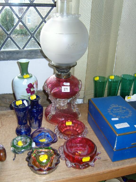 Appraisal: A th century cranberry glass oil lamp with rustic style