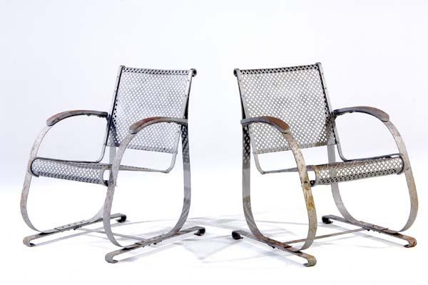 Appraisal: GARDEN Pair of steel lounge chairs with perforated seats and