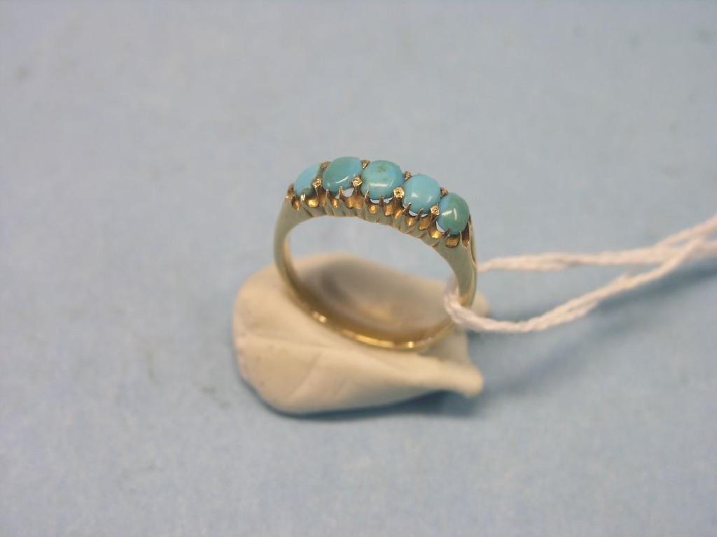 Appraisal: An ct gold half-hoop ring claw-set with five turquoises ring