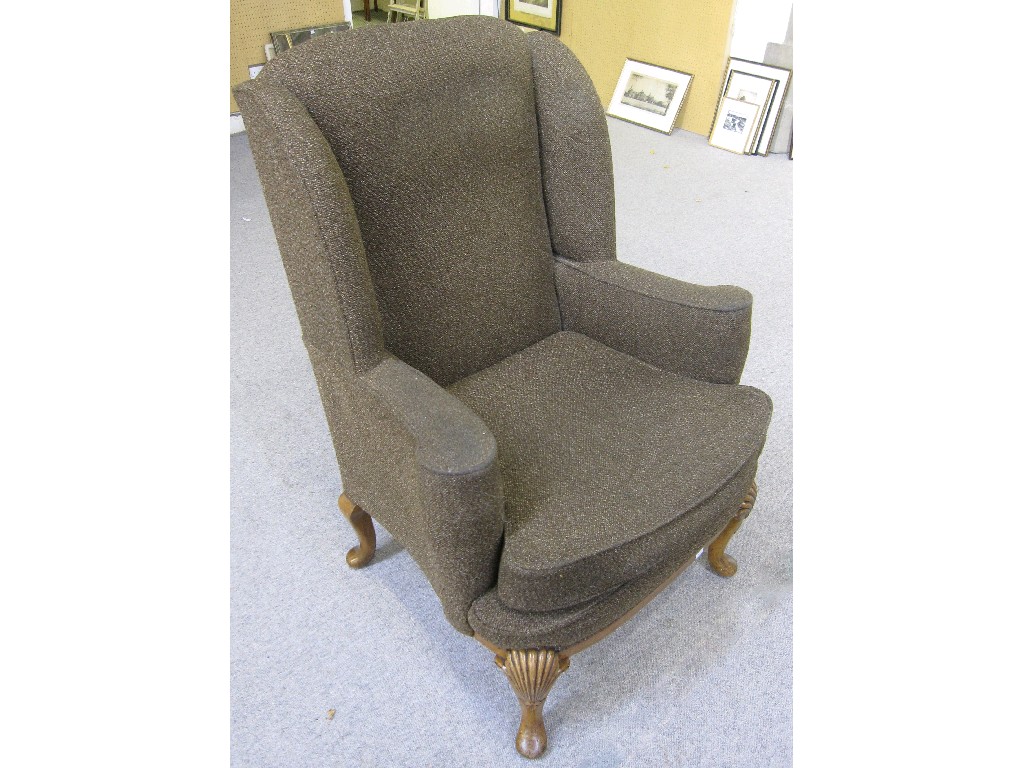 Appraisal: Upholstered wingback armchair on cabriole legs with shell carved knees