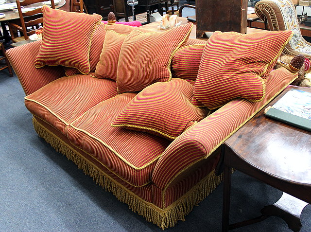 Appraisal: A RED AND GOLD UPHOLSTERED KNOWL TYPE TWO SEATER SOFA