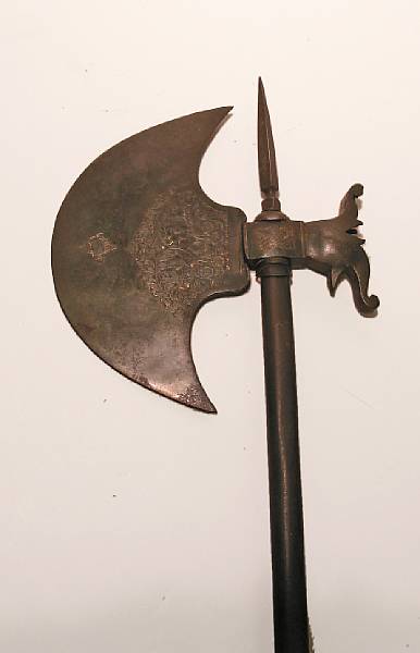 Appraisal: An Indian axe th century Broad crescent-shaped blade chased with