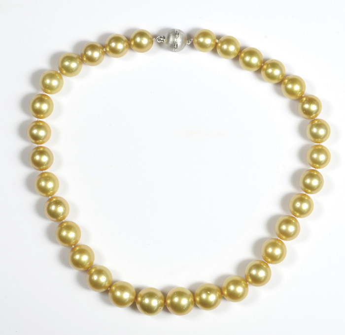 Appraisal: GOLDEN SOUTH SEA PEARL NECKLACE with graduated round golden pearls