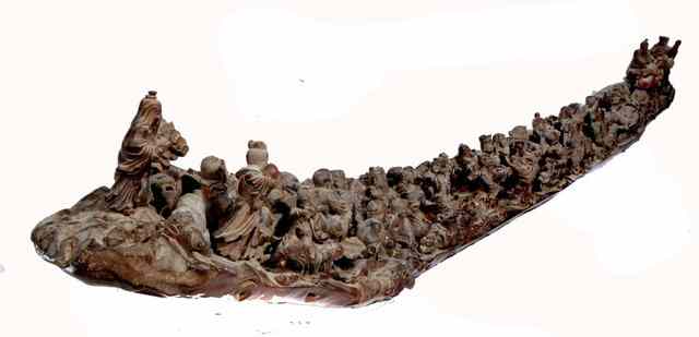 Appraisal: A LARGE CHINESE CARVED BOAT SHAPED BRANCH with extensive sculpture