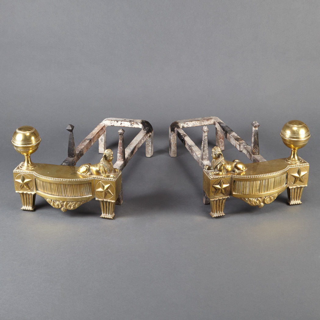 Appraisal: Pair of Egyptian Revival Gilt-Bronze Chenets Each of bowfronted form