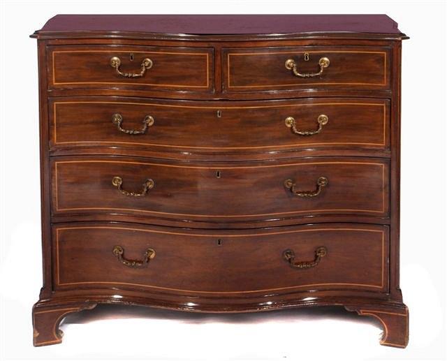 Appraisal: A GEORGE III MAHOGANY SERPENTINE SHAPED CHEST of two short