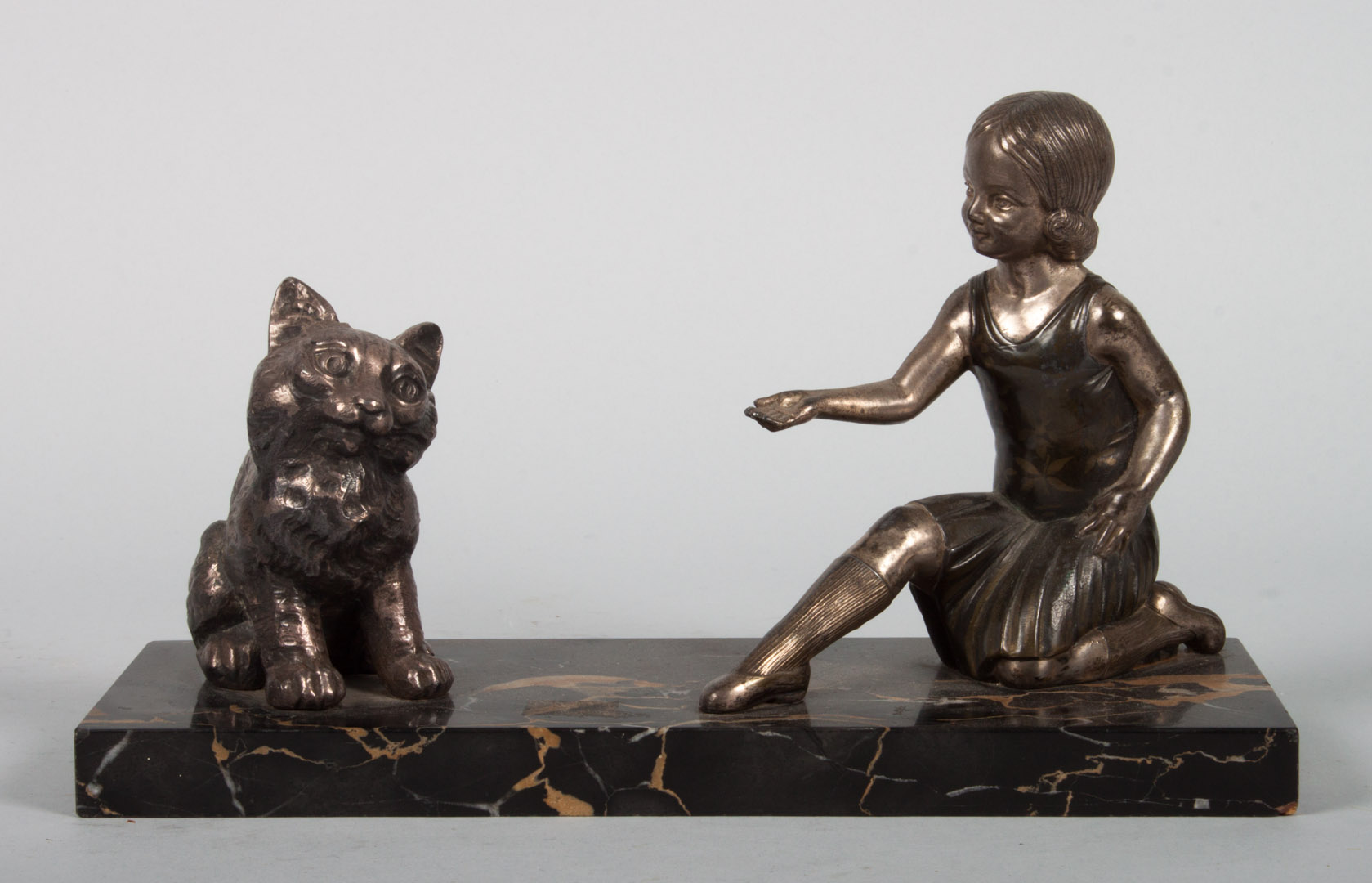 Appraisal: American School ballerina and kitten sculpture circa 's silvered metal