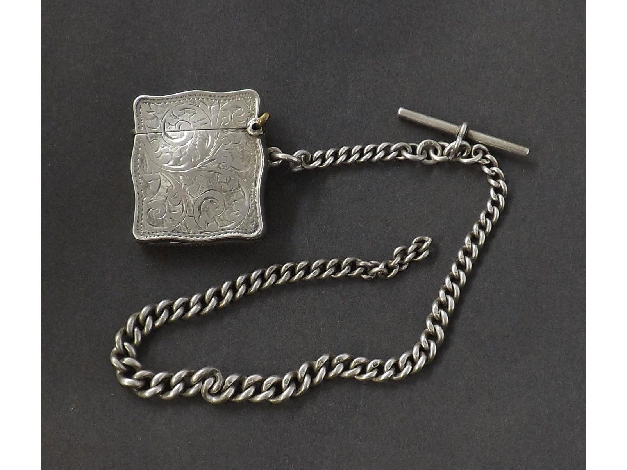 Appraisal: Bomb serpentine silver vesta case engraved with foliage upon a