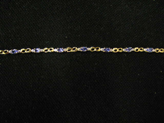 Appraisal: Tanzanite Diamond Bracelet oval gems and diamonds in k yellow