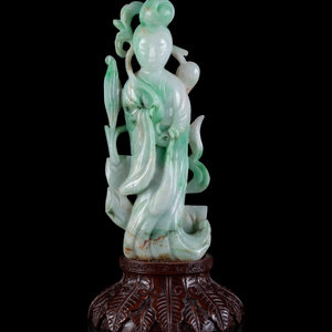 Appraisal: A Chinese Apple Green and Pale Celadon Jadeite Figure of