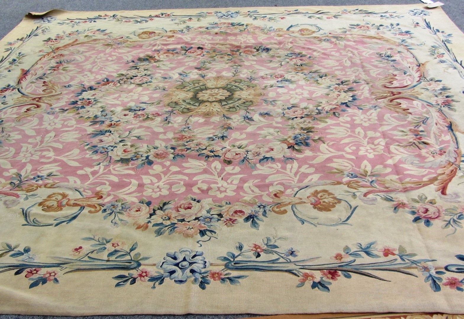 Appraisal: An Aubusson tapestry carpet the pink field with a central