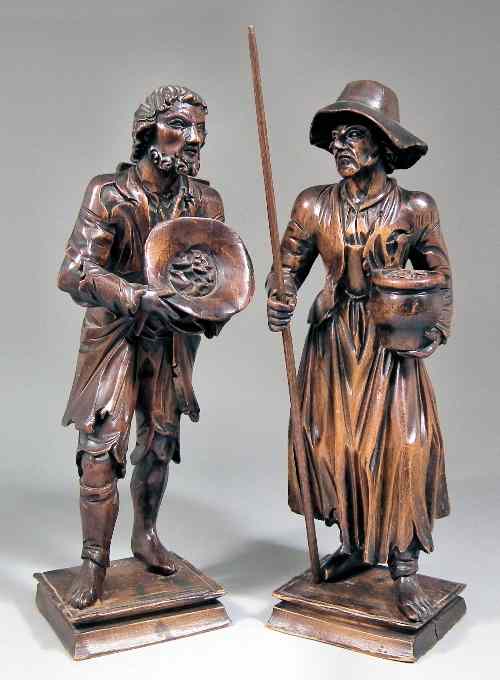 Appraisal: A pair of Continental carved softwood standing figures of peddlers