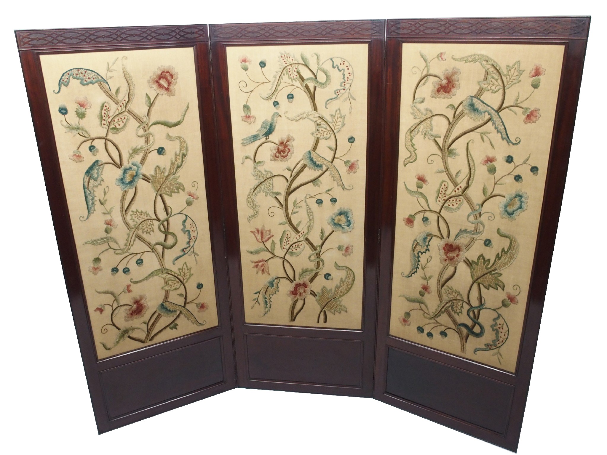 Appraisal: A mahogany three fold draft screenwith floral crewelwork panels beneath