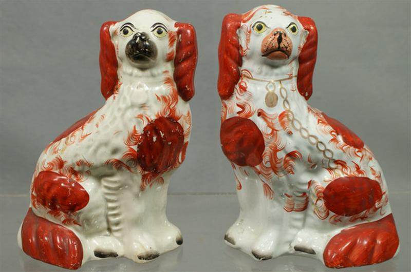 Appraisal: Unmatched pr Staffordshire white rust spaniels black gilt trim craquelure