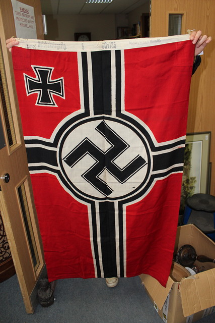 Appraisal: A GERMAN NAVAL FLAG inscribed to the edge 'Reichskriegsflg X