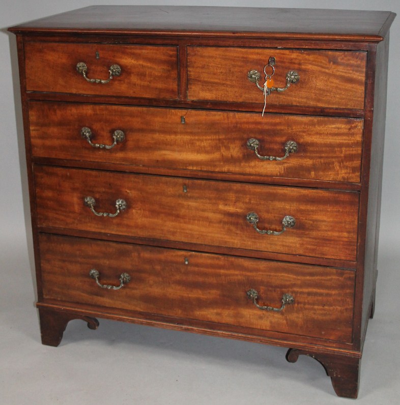 Appraisal: An early thC mahogany chest of two short and three