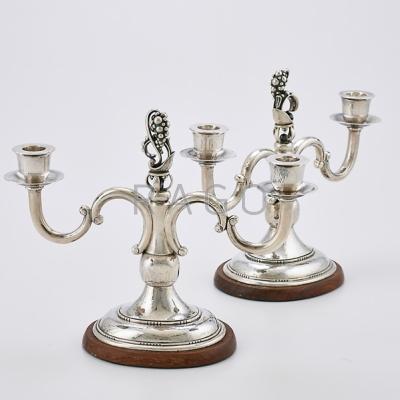 Appraisal: PAIR OF TWO LIGHT STERLING CANDELABRA Spot-hammered with stylized grape